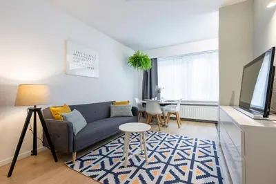a living room with a couch and a table at Theaterstudio 2 Antwerp in Antwerp