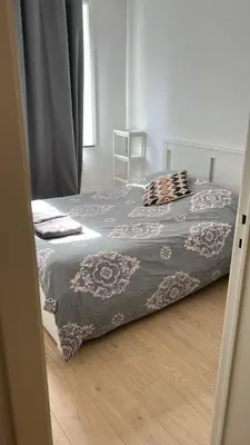 a bedroom with a bed with a blanket on it at Best nest in Brussels
