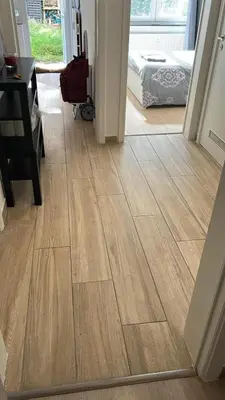 a hallway with a wooden floor in a room at Best nest in Brussels
