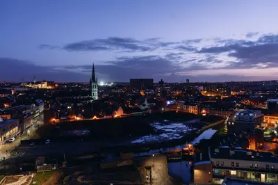 a view of a city at night at De Hoorn in Leuven