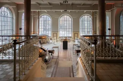 a large building with a large room with windows at De Hoorn in Leuven