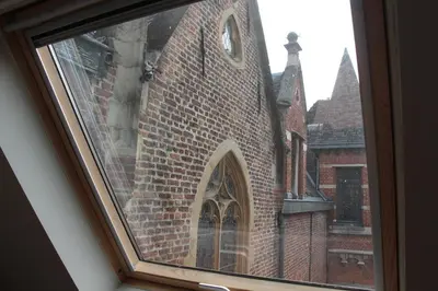 a view of a brick building with a window at HOFMARKGRAAF - Unique apartment in historic Antwerp mansion in Antwerp