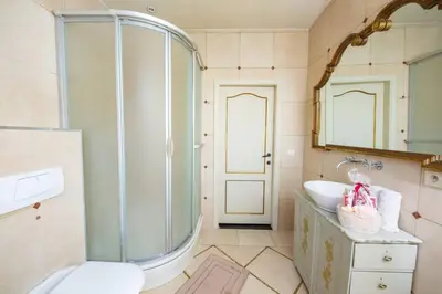 a bathroom with a glass shower and a sink at HOFMARKGRAAF - Unique apartment in historic Antwerp mansion in Antwerp