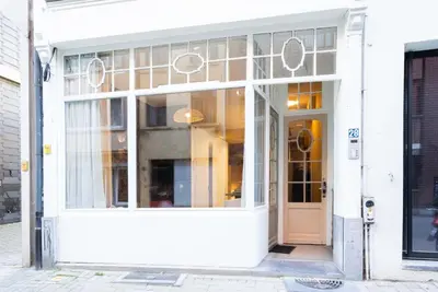 a store front with a large window and a door at SHWAY - The Red Monkey in Antwerp