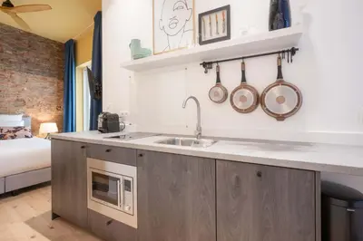 a kitchen with a sink and a microwave at SHWAY - The Red Monkey in Antwerp