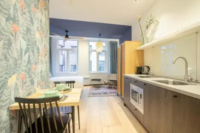 a kitchen with a table and a dining room at SHWAY - The Blue Parrot in Antwerp