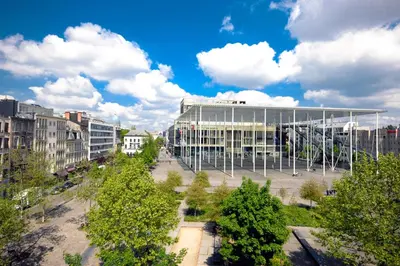 a large building in the middle of a city at Modern Cityflat at Theaterdistrict in Antwerp