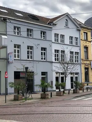 a white building on the side of a street at Elma’s Place in Ghent