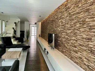 a living room with a brick wall at Luxurious villa during tomorrowland in Hemiksem