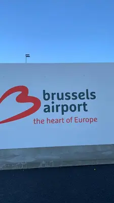 a sign for the benefit of enterprise on the side of a building at Panda Bella in Zaventem