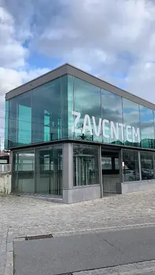 a building with a sign on the side of it at Panda Bella in Zaventem