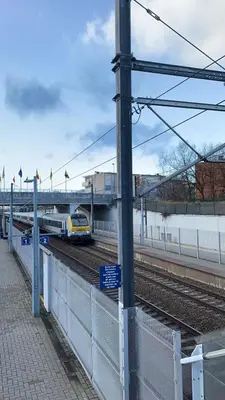 a train is going down the tracks near a train station at Panda Bella in Zaventem