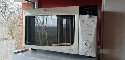 a microwave oven sitting on top of a counter at Green Hill Apartment Overijse in Overijse