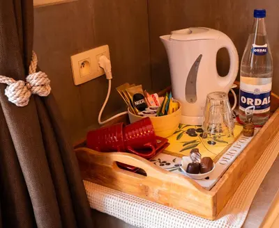 a table with a coffee maker on top at B&B OLEN in Olen