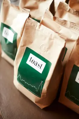 a group of brown bags with the words trust at B&B Toast Hoogstraten in Hoogstraten