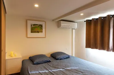 a bedroom with a bed with two pillows on it at B&B Steendam 66 in Ghent