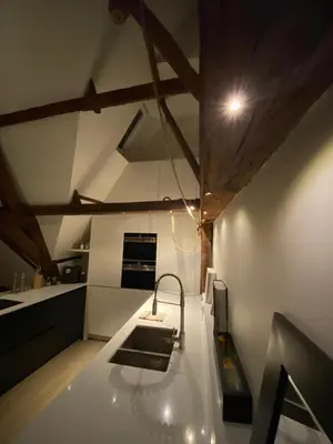 a kitchen with a sink and a counter top at Burgstraat 17 Apartment in Exclusive Patrician House in Medieval Ghent in Ghent
