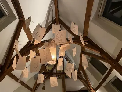 a chandelier with notes hanging from a ceiling at Burgstraat 17 Apartment in Exclusive Patrician House in Medieval Ghent in Ghent