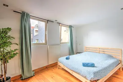 a bedroom with a bed and a window at Tempel Cathedral Lodge in the Heart of Antwerp in Antwerp