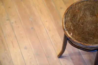 a wooden stool sitting on top of a wooden floor at Well-situated and Comfortable Home in Ghent