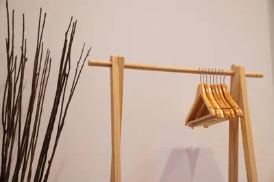a wooden pole with a broom next to a plant at Well-situated and Comfortable Home in Ghent