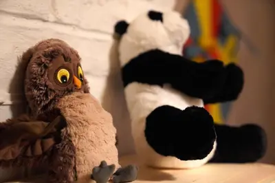 two stuffed animals are sitting on a table at Well-situated and Comfortable Home in Ghent