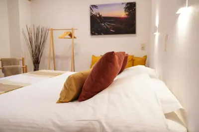a bedroom with a bed with two pillows on it at Well-situated and Comfortable Home in Ghent