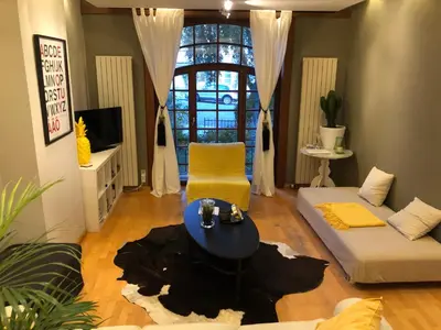 a living room with a couch and a table at Apartment Easyway to sleep in Brussels