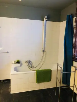 a bathroom with a bath tub and a shower at Apartment Easyway to sleep in Brussels