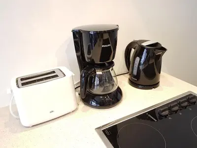 a blender and a toaster sitting on a counter at The National Lodge in Antwerp