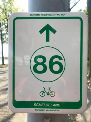 a sign on a pole with a speed limit at Aquavilla Bed & Breakfast in Willebroek
