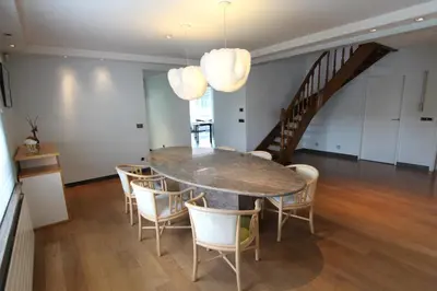 a dining room with a table and chairs at NUVOLA VILLA in Zottegem