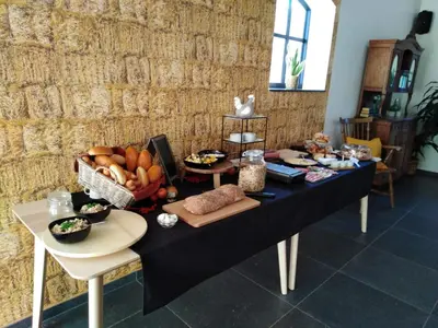 a table with food on it in a room at B&B Tantine in Retie