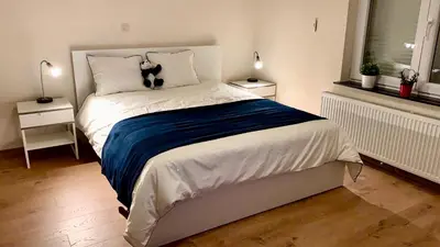 a bedroom with a bed with a dog on it at Panda Stella in Zaventem