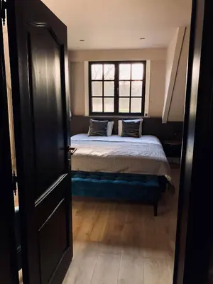 a bedroom with a bed and a window at 't Averhuys in Itegem