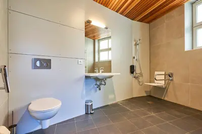 a bathroom with a toilet and a sink at HI Brussels Jacques Brel Hostel in Brussels