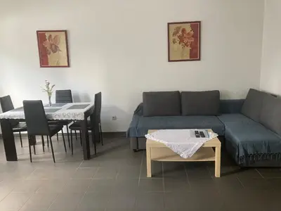 a living room with a couch and a table at Private apartment near Brussels in Asse