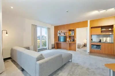 a living room with a couch and a table at Verac Flats in Zaventem