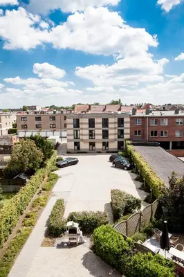 an empty parking lot in front of a building at Verac Flats in Zaventem