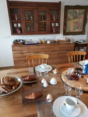 a wooden table with food and eggs on it at Elingenhof in Elingen