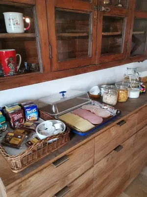 a kitchen counter with some food and baskets on it at Elingenhof in Elingen