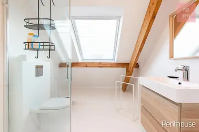 a bathroom with a shower and a toilet and a sink at Lovely & Stylish accommodations at P36 Gent, near the Center in Ghent