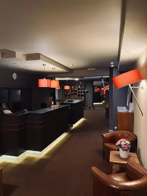 a lobby with a bar and a waiting room at HOTEL BORNEM in Bornem
