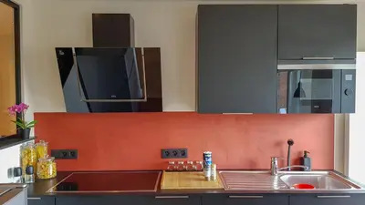 a kitchen with a sink and a microwave at Cocoon in East-Brussels in Wezembeek-Oppem