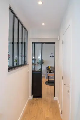 a hallway with a door leading to a living room at Cocoon in East-Brussels in Wezembeek-Oppem