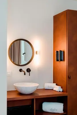 a bathroom with a sink and a mirror at The Librarian by Domani Hotels in Ghent