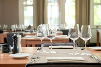 a group of wine glasses sitting on a table at De Statie in Brecht