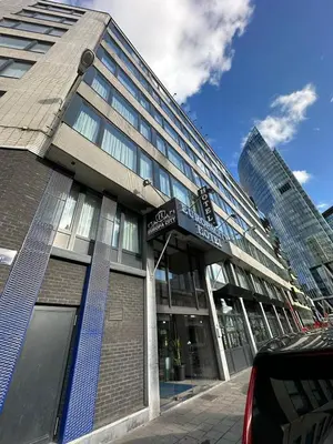 a building with a sign on the front of it at Hotel EUROPACITY in Brussels