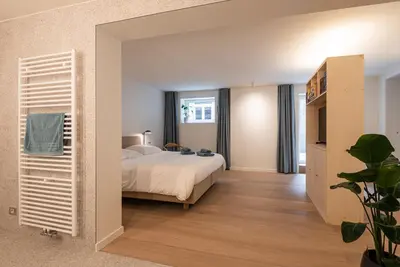 a bedroom with a bed and a window at Gepetto's - Beautiful stay in the Historic centre of Ghent - in Ghent