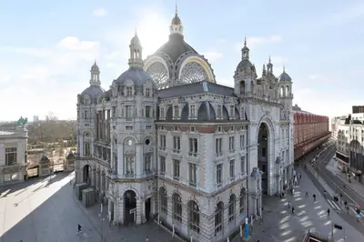 a large building with a tower on top of it at City PENTHOUSE, rooftop terrace, free NETFLIX, wifi and airco in Antwerp